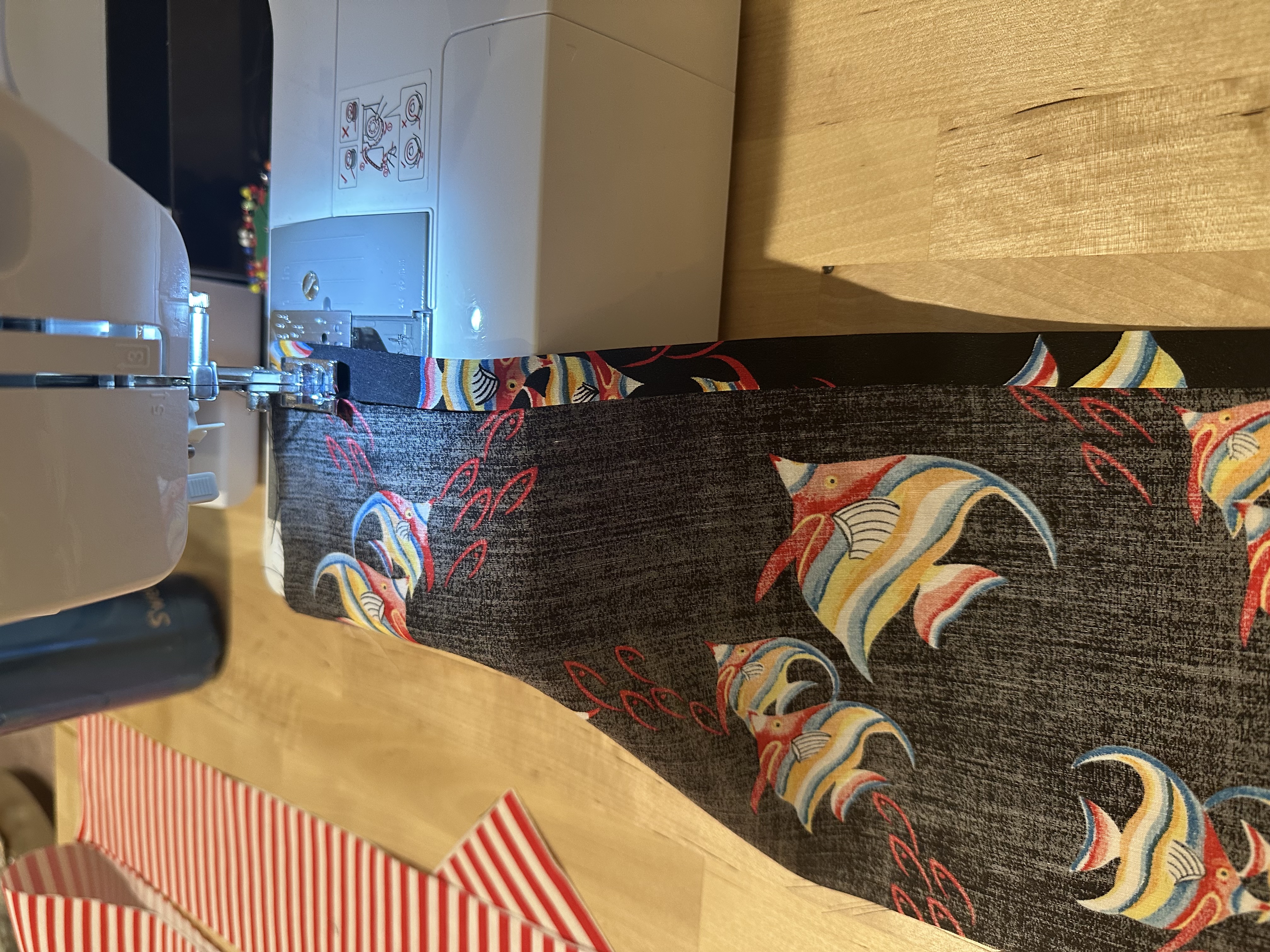 The Billy Bag partway through construction, striped exterior and fish print lining pinned together